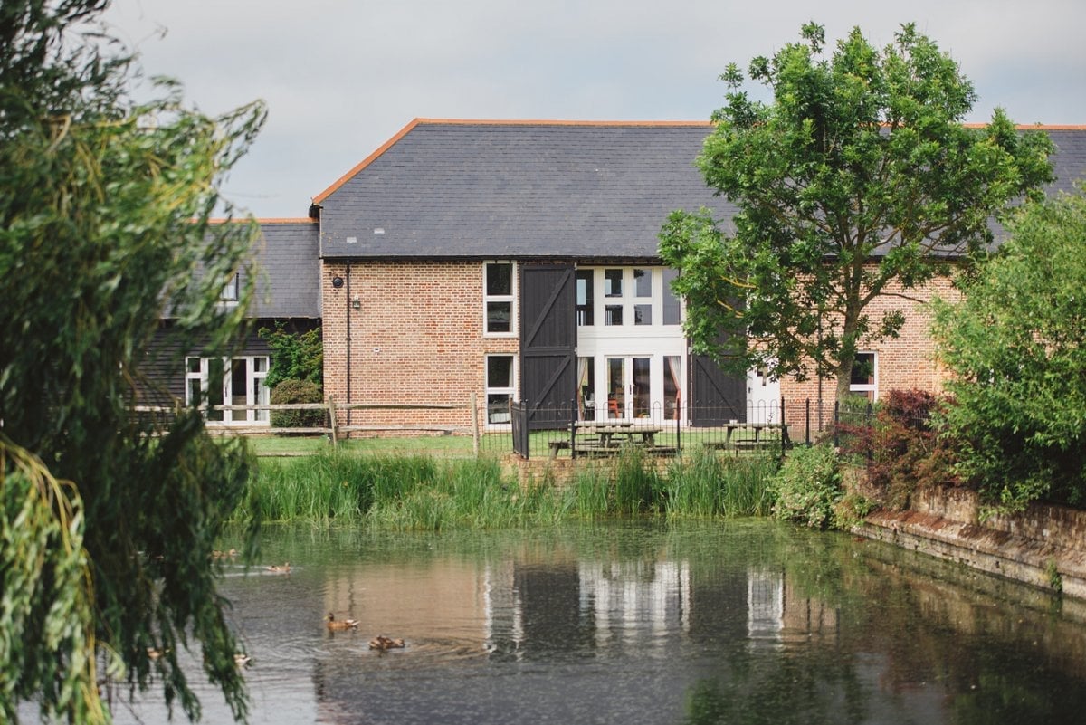The beautiful Mocketts Farm Cottages have a lovely fenced duck pond at their heart